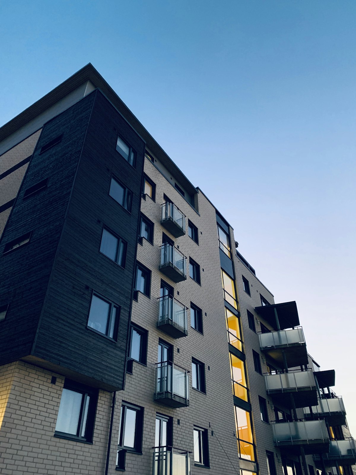 Residential apartment building exterior at dusk